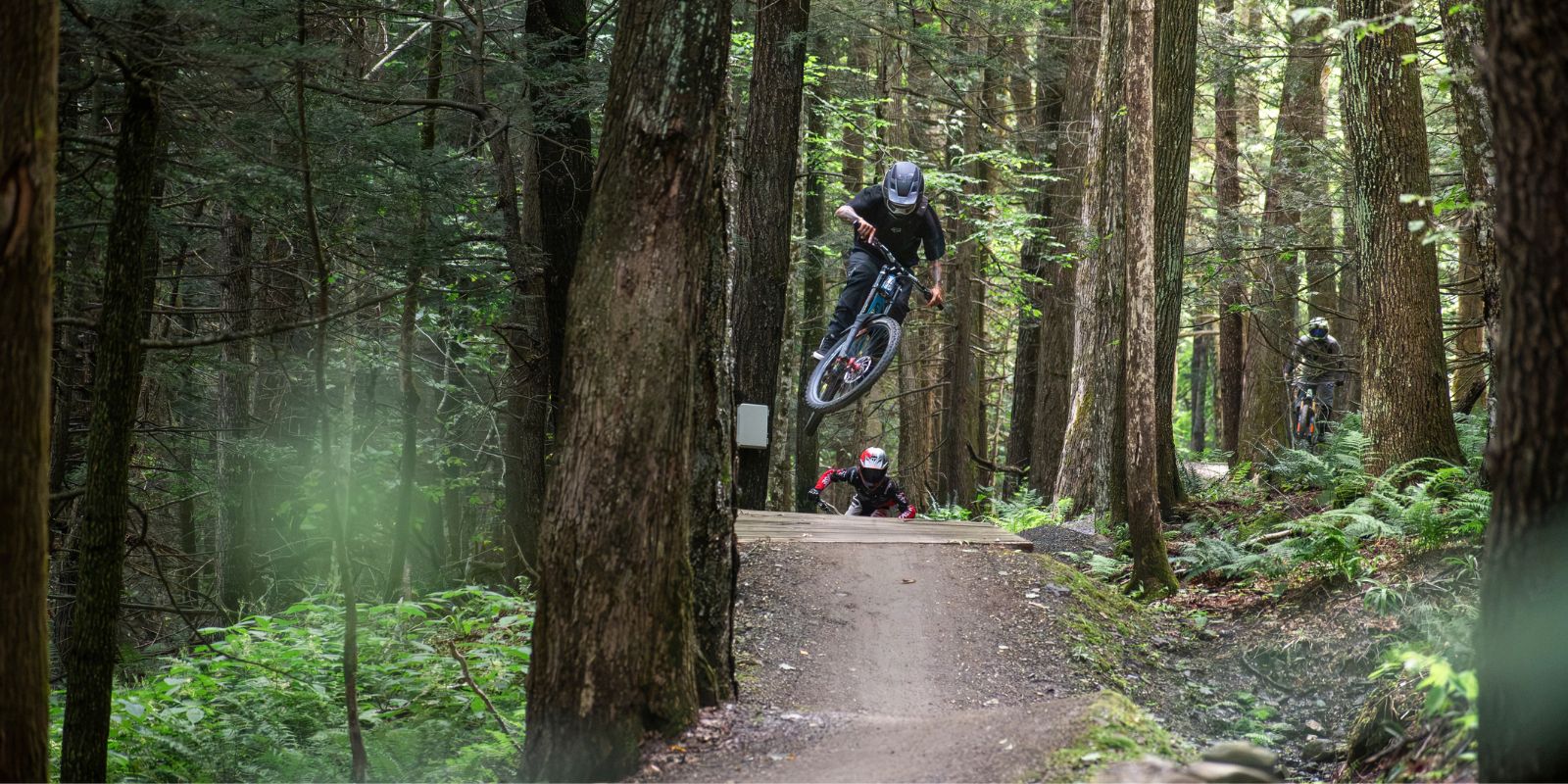Riders in the woods at Thunder Mountain Bike Park